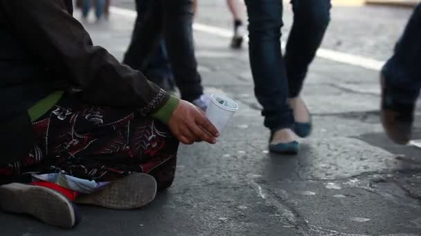 depositphotos_63475609-stock-video-woman-homeless-begging